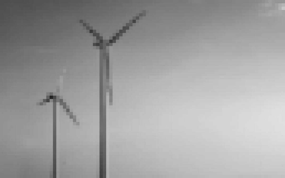 Wind turbines against the sky, pixelated so the client can’t be identified